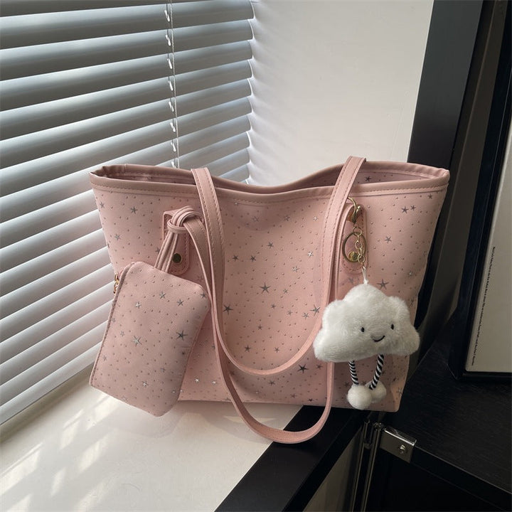 Women's large tote bag with sparkling star design and detachable cosmetic pouch
