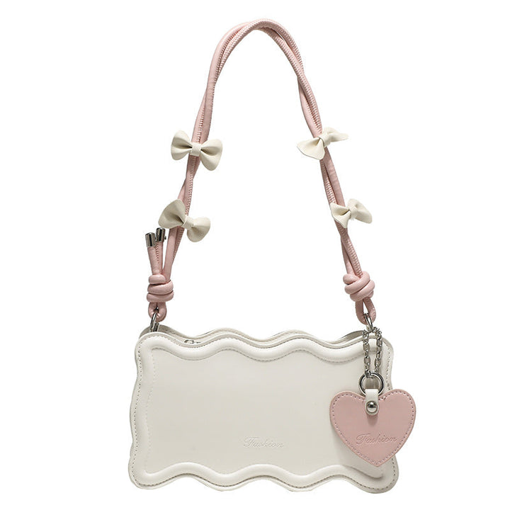 Women's mini handbag with creative wave pattern and playful pendant