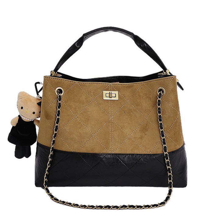 Women's shoulder bag with elegant chain accent and cute pendant