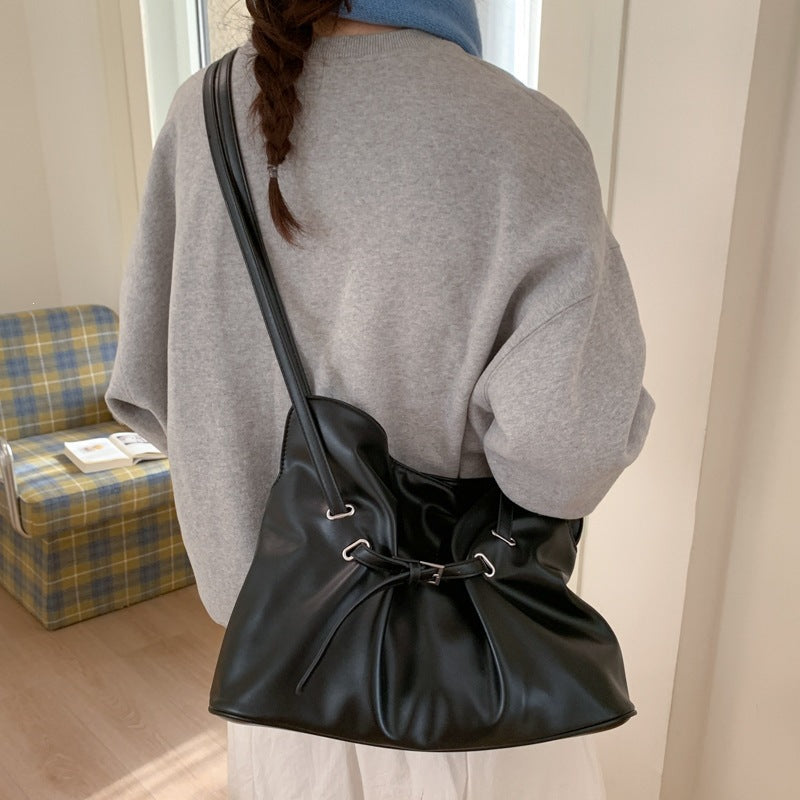 Women's shoulder bag made of high-quality synthetic leather with adjustable drawstring