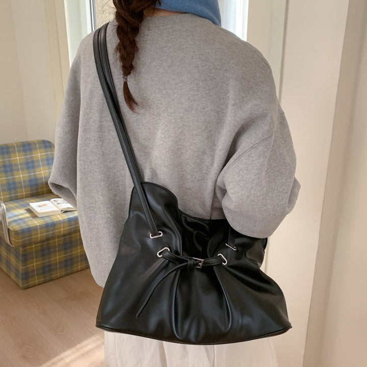 Women's shoulder bag made of high-quality synthetic leather with adjustable drawstring