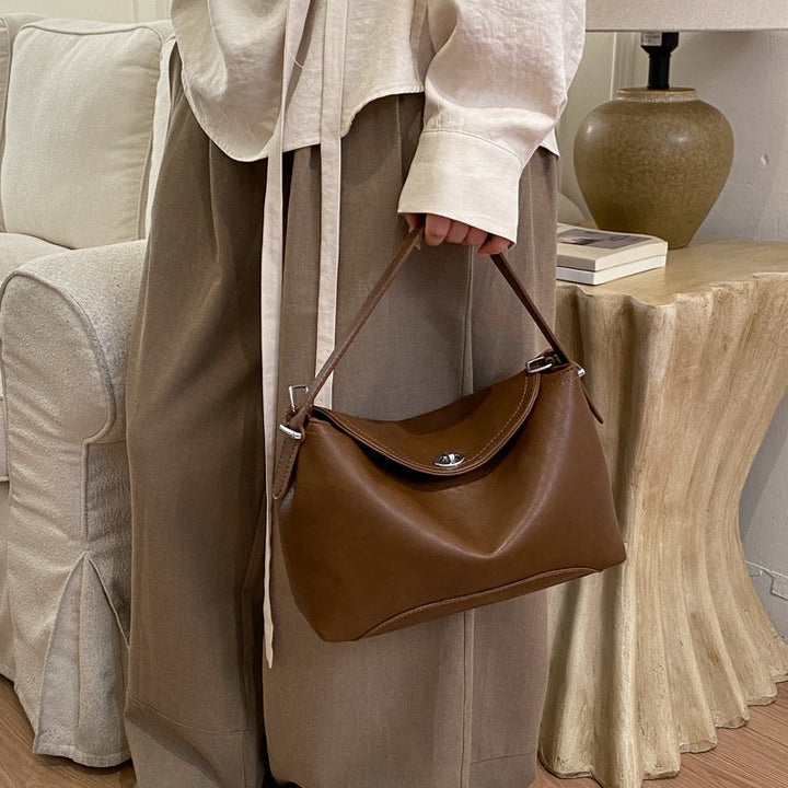 Women's handbag with flexible strap and elegant design