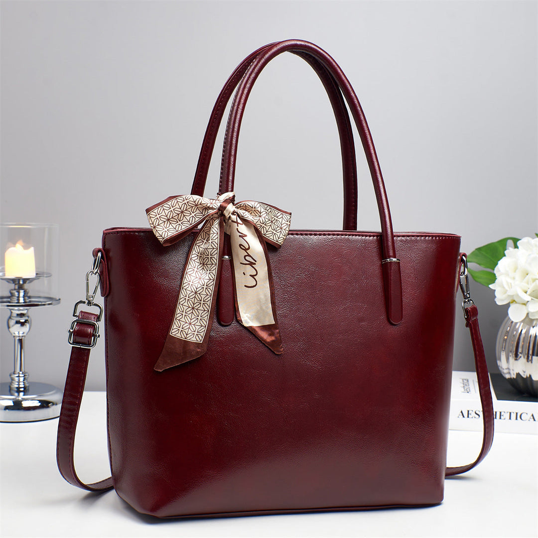 Women's elegant shoulder bag with playful bow accent