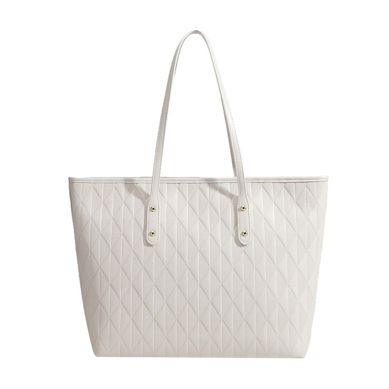 Women's tote bag with elegant diamond design and practical inner compartments