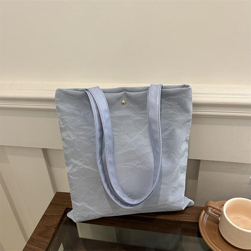 Women's tote bag made of high-quality synthetic leather with a textured surface