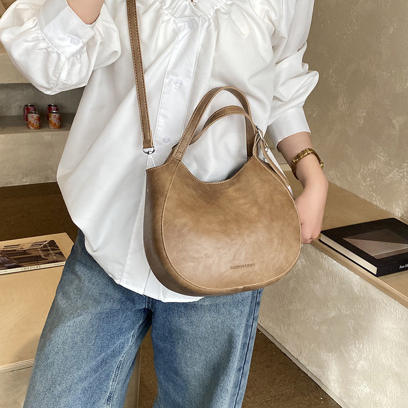 Women's shoulder bag made of high-quality artificial leather with fashionable trim