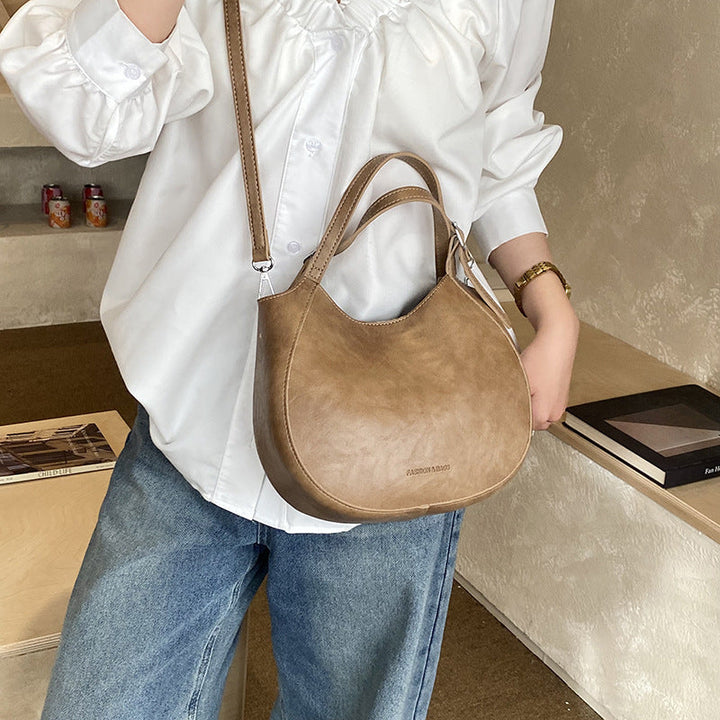 Women's shoulder bag made of high-quality artificial leather with fashionable trim