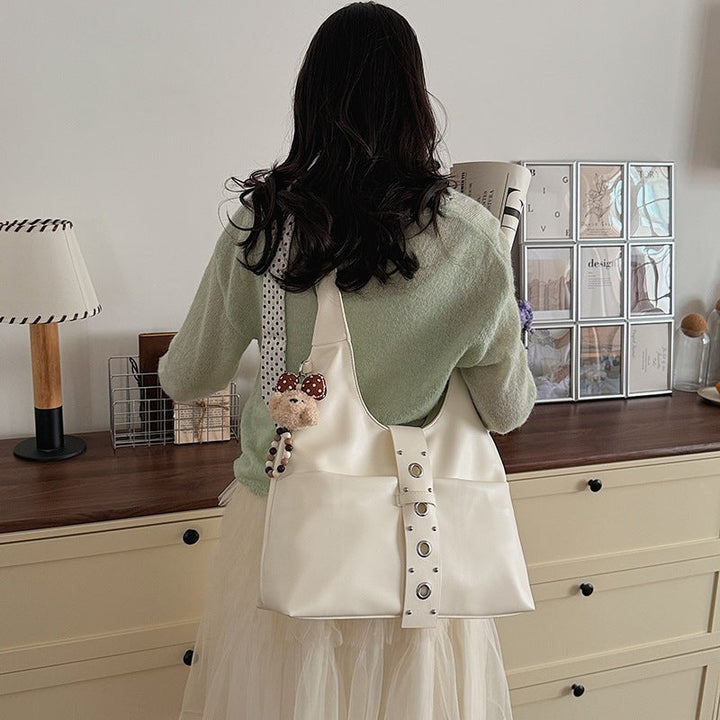 Ladies crossbody bag made of high-quality artificial leather with practical attachments