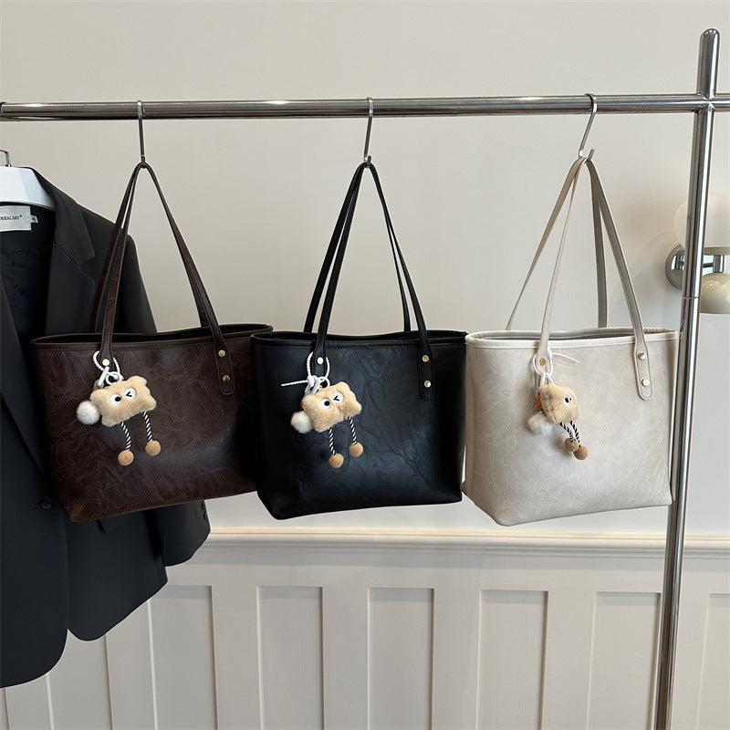 Women's classic tote bag with charming plush toy pendant