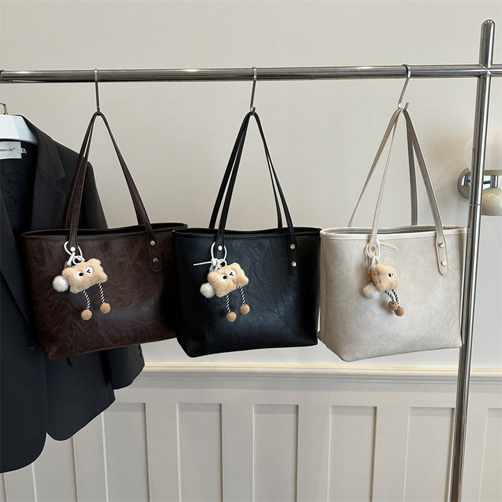 Women's classic tote bag with charming plush toy pendant