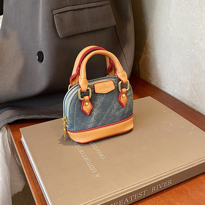 Women’s mini hobo bag made of textured synthetic leather with golden accents