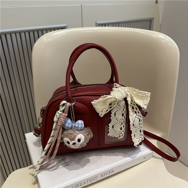 Ladies Mini Handbag with playful animal motif and charming charm