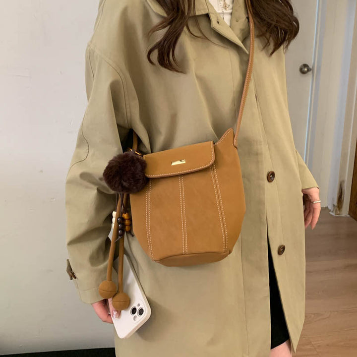 Ladies fashionable crossbody bag with fluffy pendant