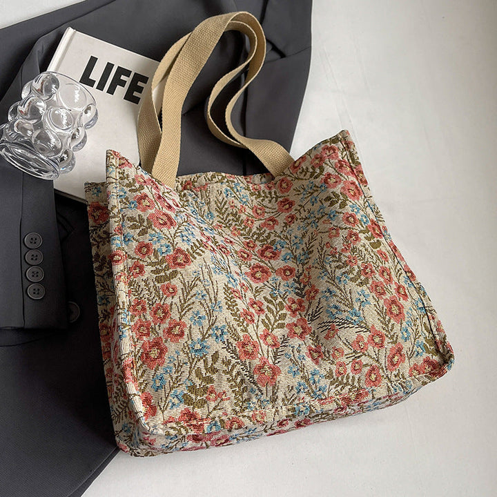 Women's tote bag with floral embroidery design and sturdy handles