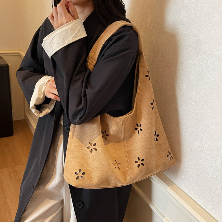 Women's hobo bag with floral accent and practical mini wallet