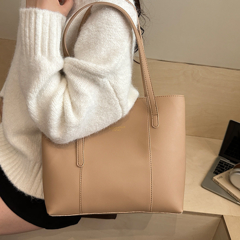 Women's elegant tote bag made of high-quality faux leather with distinctive design