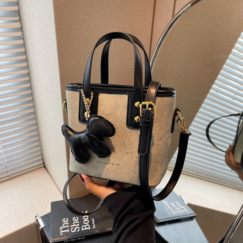Women's mini bag made of high-quality material with removable funny charm