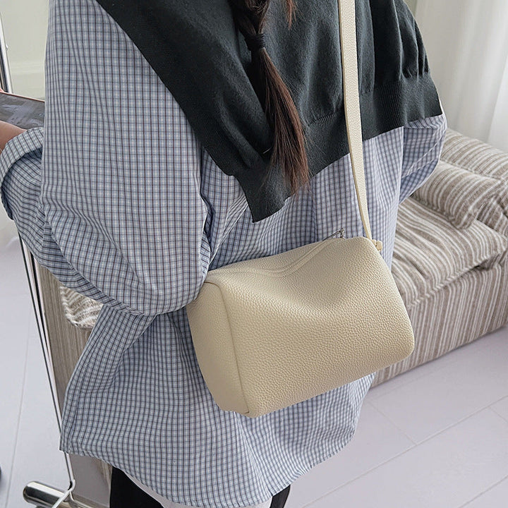 Women’s shoulder bag in modern design with structured surface