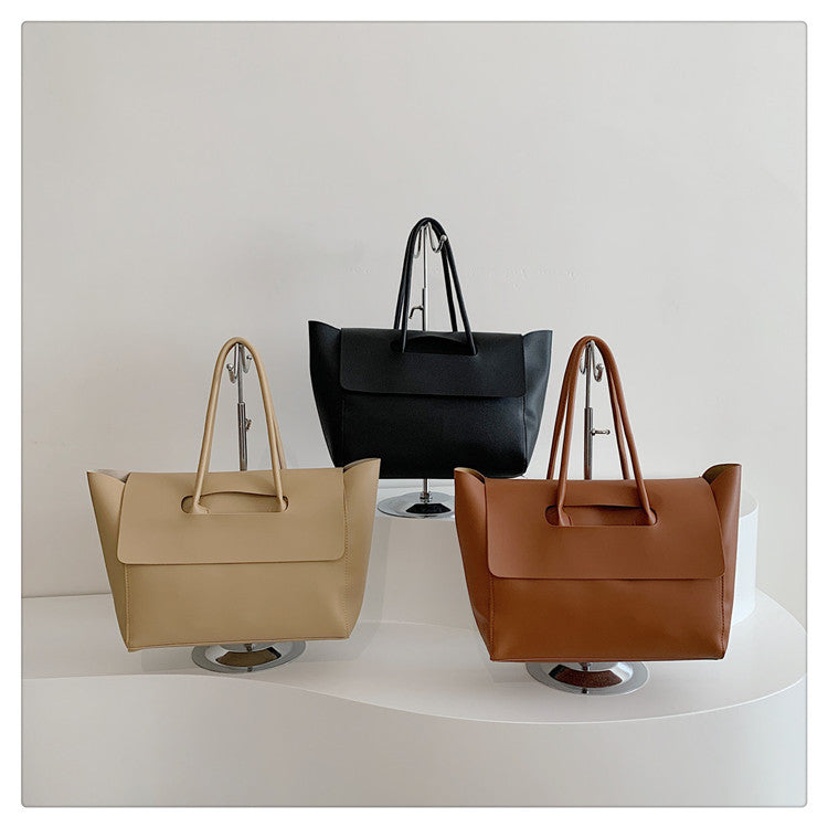 Women's tote bag made of high-quality, durable material with elegant monogram